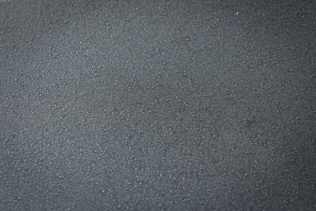 View of water droplets over car surface due to mist. Drizzle over shiny car surface.の写真素材