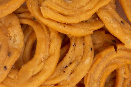 Close view of murukku which is a popular south indian savoury. Indian sweet and savoury prepared...