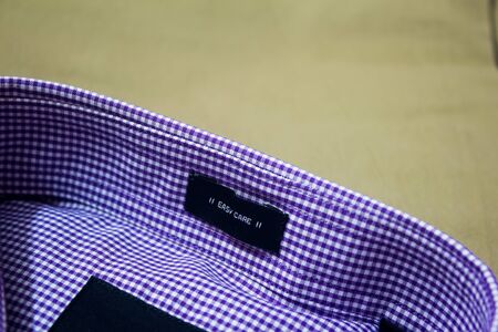 Ironed shirt and trouser placed over one another. New shirt over khaki coloured pant.