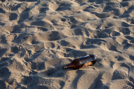 Chennai, Tamil Nadu / India - February 05 2020: Pollution in marina beach with bottle thrown in sand, Chennai, Indiaのeditorial素材