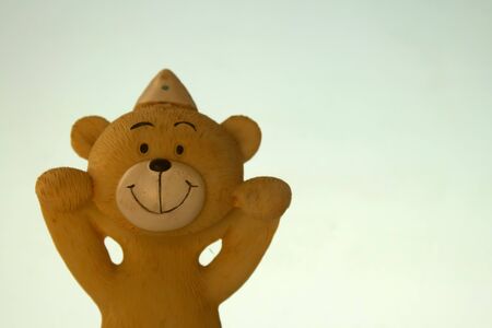 View of cute little monkey toy with its hands raised.の写真素材