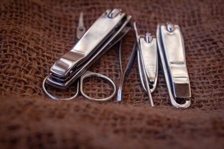 View of different size nail clippers and also scissors.