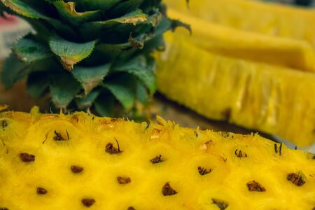 Pineapple skin removed and sliced into long pieces. Pineapple is healthy and good in vitamins. Use...