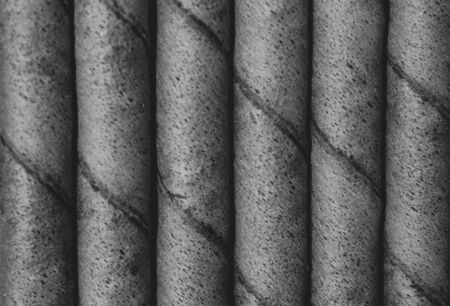 Bunch of chocolate flavored wafer rolls. Crunchy wafer rolls loved by kids.