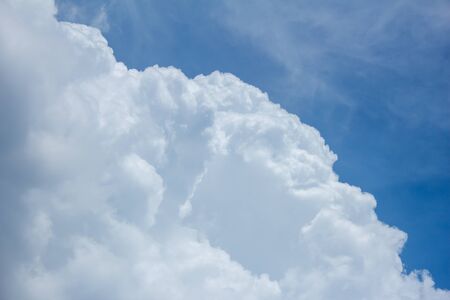 Fluffy white clouds high in the sky