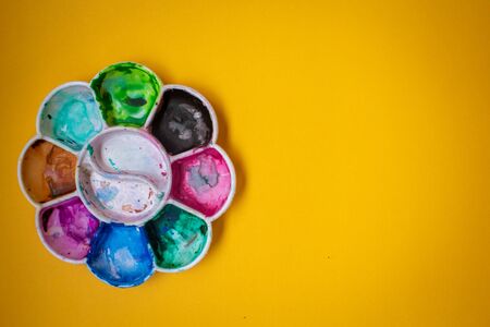 View of paint palette with different colors. Selective focus.