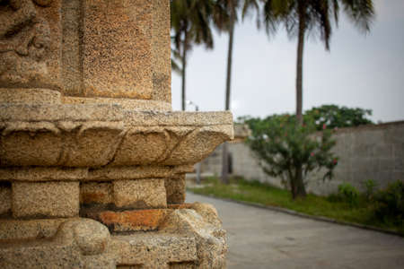 Courtyard along a beautiful ancient temple, Avani, Karnataka, India. Selective focus on the temple wall.の写真素材