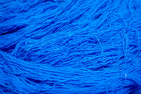 Close view of the blue color thread yarns used in textile industryの写真素材