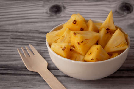 Pineapple skin removed and sliced into small pieces. Pineapple is healthy and good in vitamins. Use for healthy snack concept.の写真素材