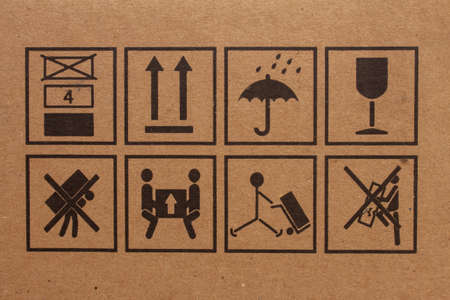 Packaging symbols to indicate which direction is up, avoid dam conditions, fragile item , not to carry on back and so onの写真素材