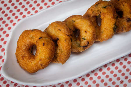 View of Medu Vada also known as Ulundu Vadai is a popular and traditional recipe of Tamil Nadu made...