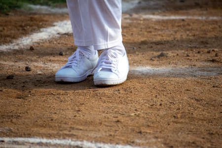 View of young kid shoes in a track and field event. Kids feet during sports event.の写真素材