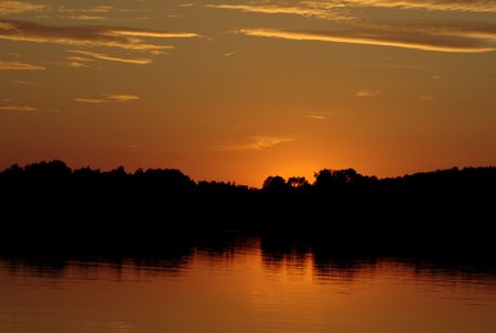 Orange sunset on the lakeの写真素材