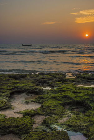 Fishing boat in the sunsetの写真素材
