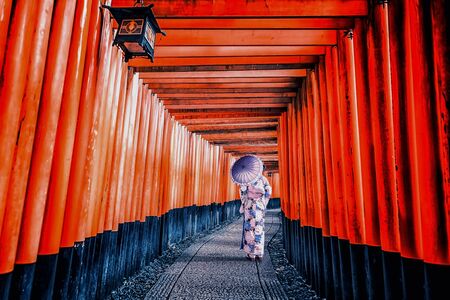 Girl with traditional dress in Fushimi Inari Taisha shrine in Kyoto, Japanのeditorial素材