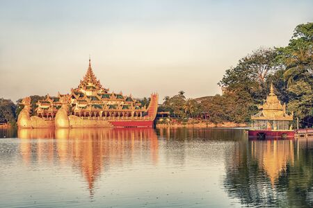 Kandawgyi Lake with the Karaweik Hall in Yangonの写真素材