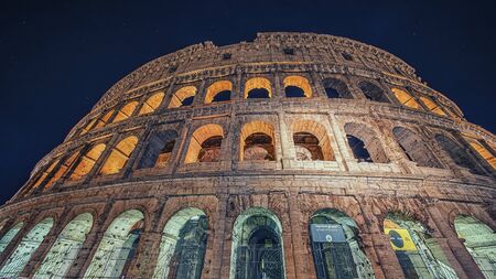Colosseum monument in Rome at nightの写真素材