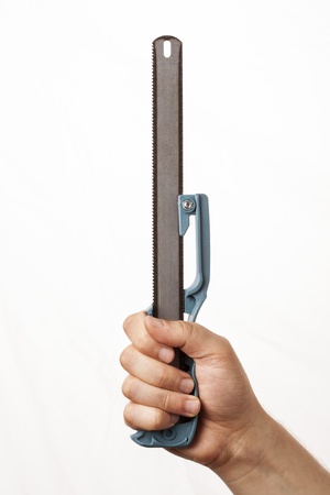 saw in man's hand isolatedの写真素材