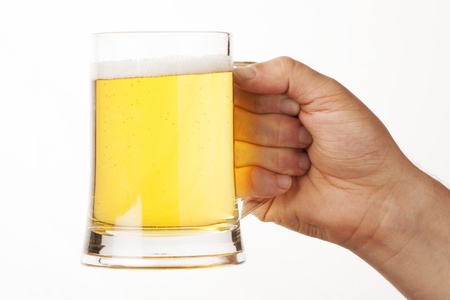 hand holding glass of beer