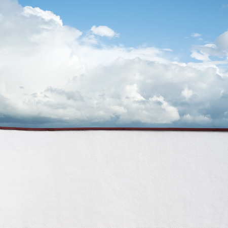 Blue sky with clouds, view from the balconyの写真素材