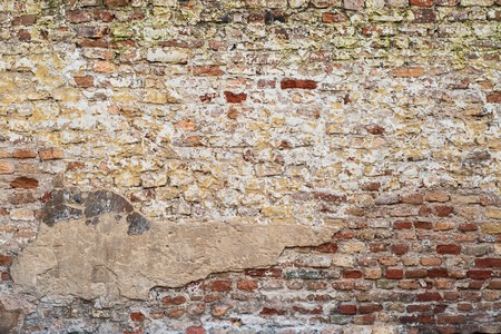 colorful abandoned grunge cracked brick stucco wall background