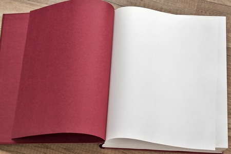Open red book on the table, white and red pagesの写真素材
