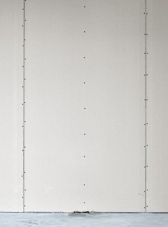 blank wall with two valves for cold and hot water in new apartmentの写真素材