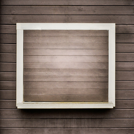 White frame on the grunge wooden plank wallの写真素材
