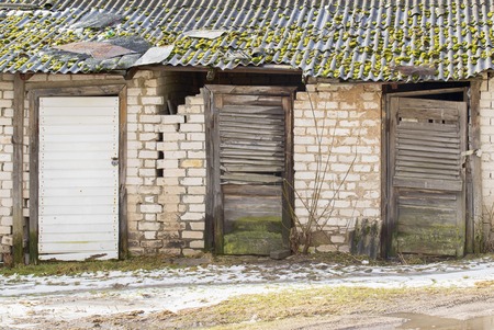 Old abandoned lumber rooms in wet winterの写真素材