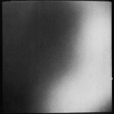 black and white medium format film background with heavy grain and light leakの写真素材