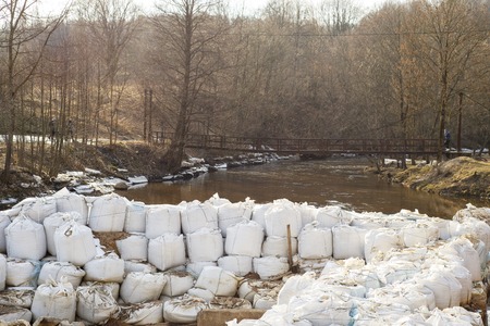 Lot of big white sandbags for flood defense.