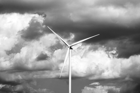 Lonely wind turbine. Stormy sky background. Black and Whitephotographyの写真素材