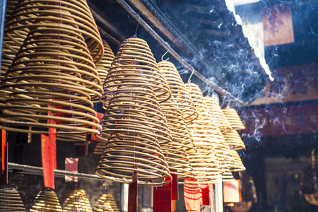chinese burns incense at Chinese Templeの写真素材