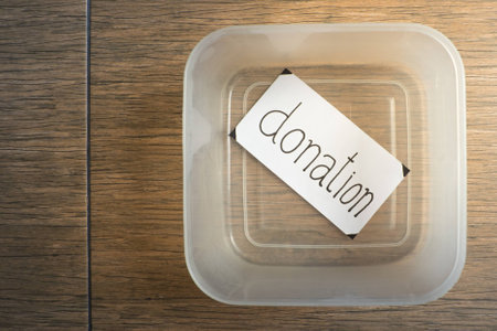 Empty donation box on wooden backgroundの写真素材