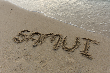 Hand written "Samui" on the beachの写真素材