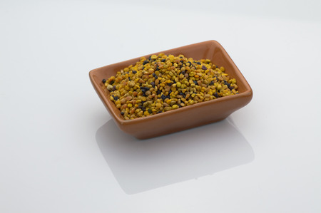 bee pollen grains on withe backgoundの写真素材