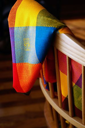 Mexican cloth woven from colourful fibers draped over a chair.の写真素材