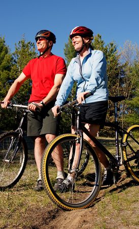 Mountain biking  boomers soak in late afternoon sunlight in Wasaga Beach, Ontario.の写真素材