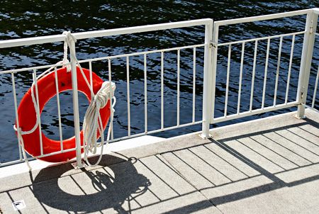 Life preserver attached to a houseboat railingの写真素材