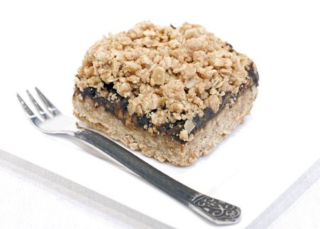 Oatmeal date square on white backgroundの写真素材