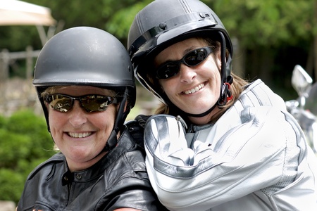 Adventurous sisters are ready to hit the road on a motorcycle tour.の写真素材