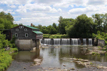 Old building by water fallの写真素材