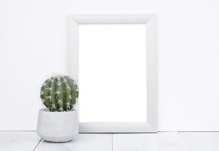 Photo frame mock up white background wooden gray floor with natural cactus in concrete flower potの写真素材