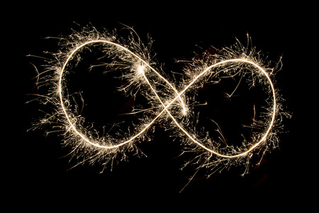 Lightpainting endless shape over blackの写真素材