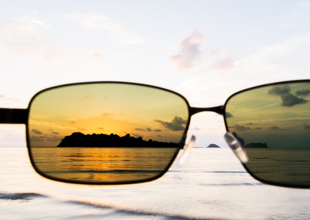 sunset at sea with sunglass