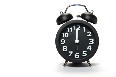 Black alarm clock  on white backgroundの写真素材