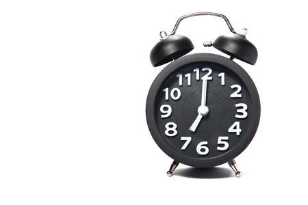 Black alarm clock  on white backgroundの写真素材