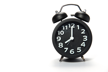 Black alarm clock  on white backgroundの写真素材