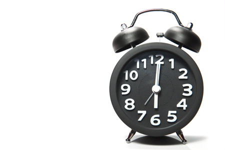 Black alarm clock  on white backgroundの写真素材