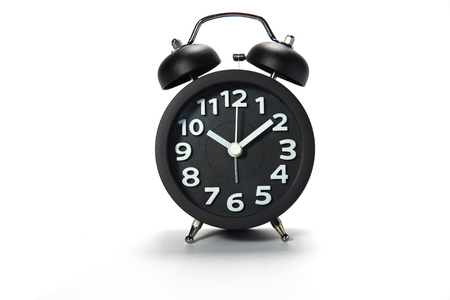 Black alarm clock  on white backgroundの写真素材